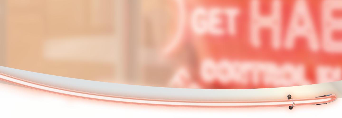 An upclose photo of a neon sign reading 'Get HAE under control'.